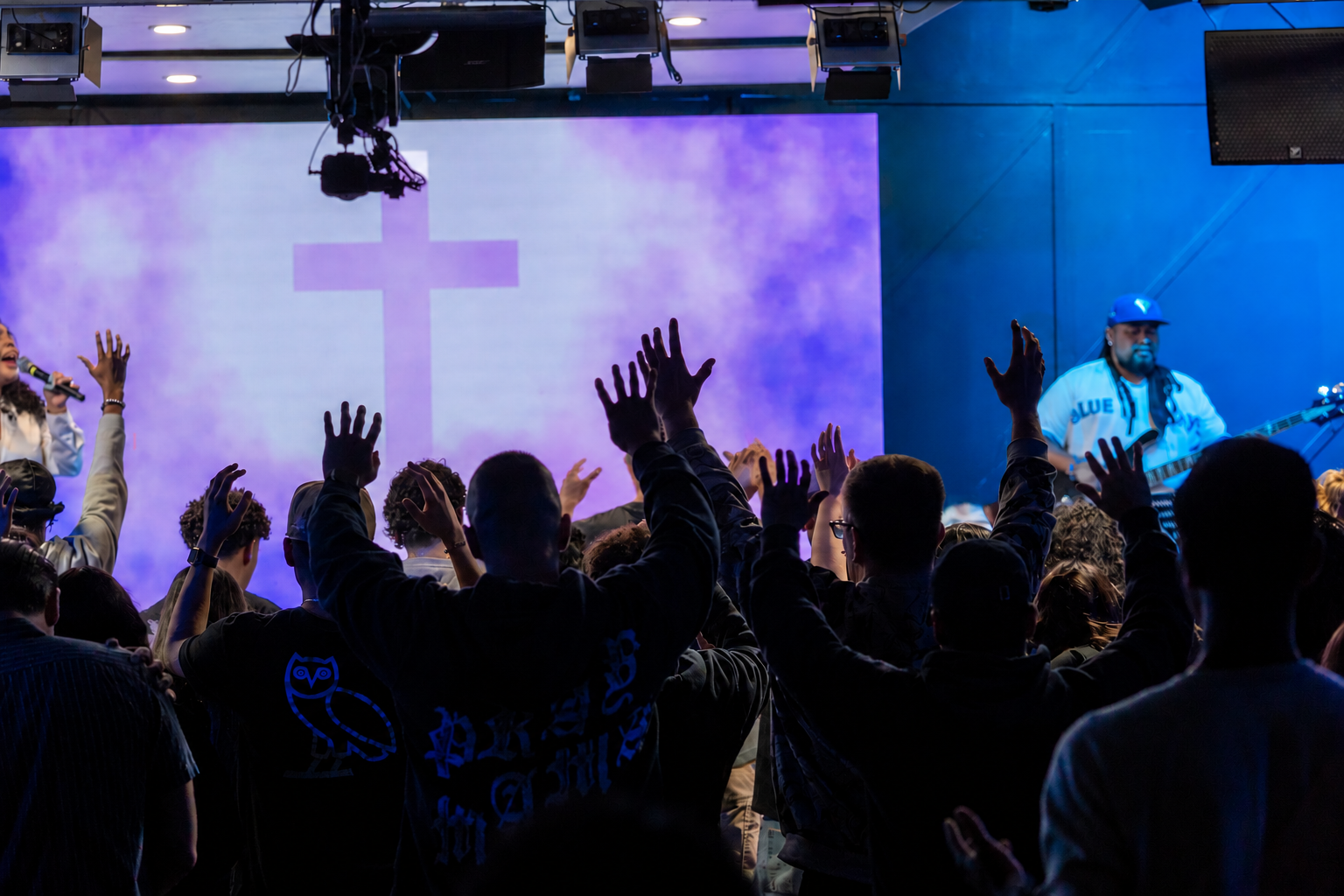 Congregation worshipping together at a Generations Church Sunday service